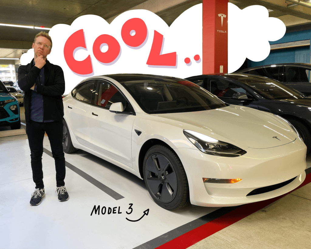 Me standing in front of the Tesla Model 3, thinking about it, with talk bubble saying COOL behind it