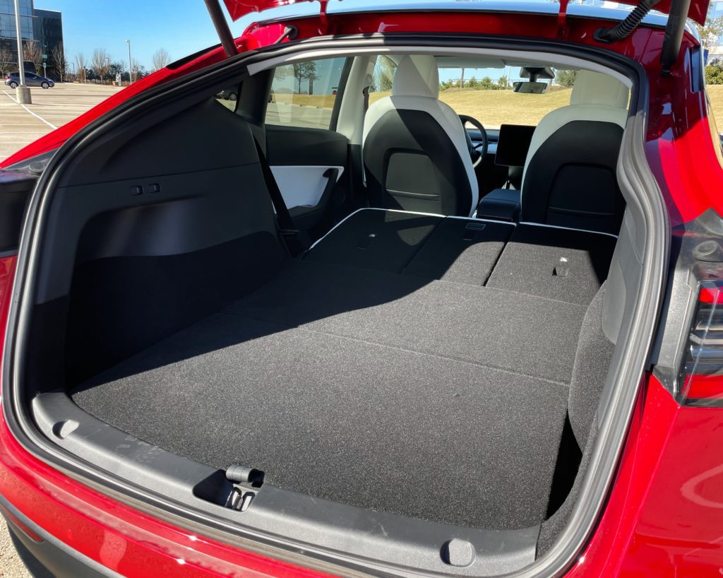 Interior view of the Tesla Model Y trunk space with seats folded down