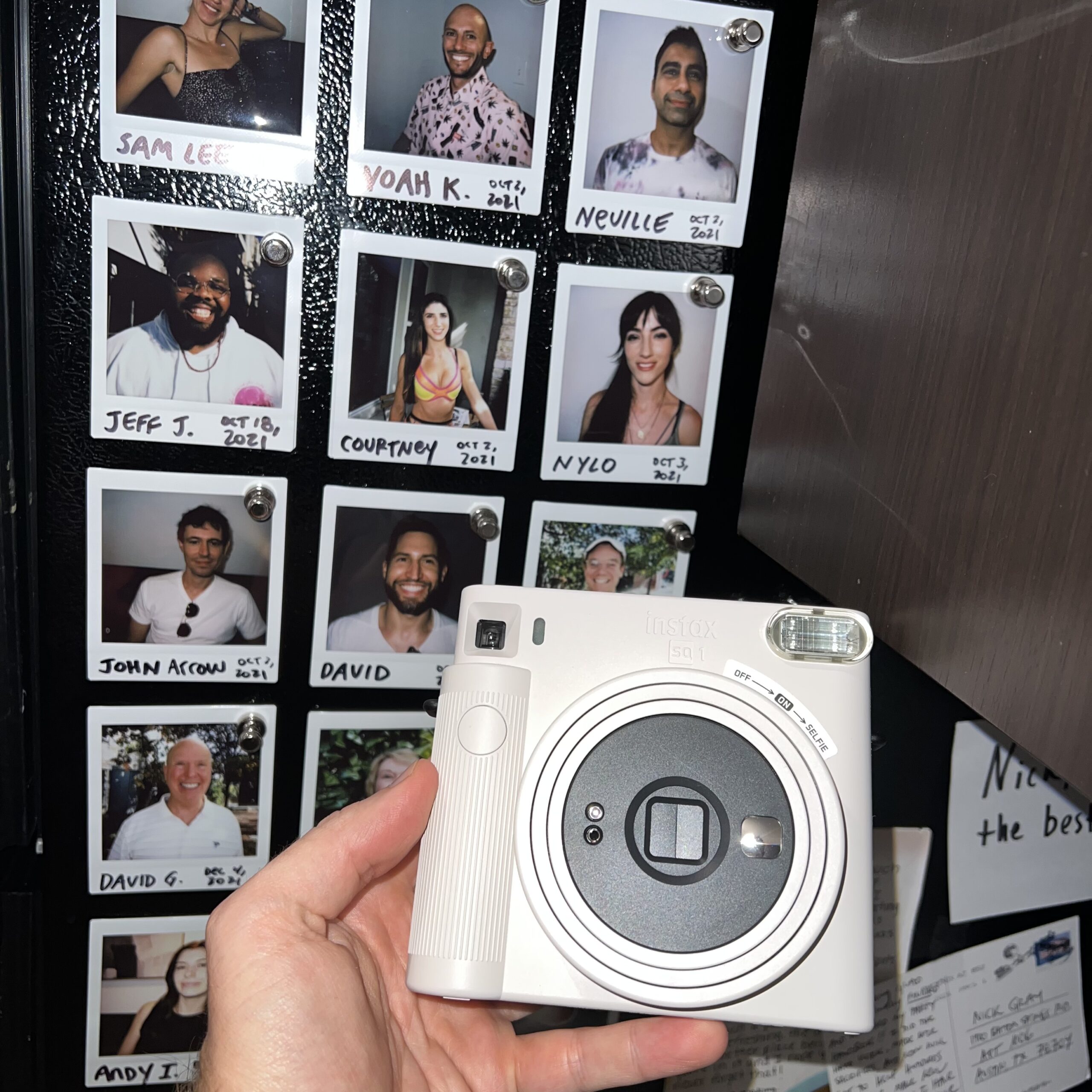 hand holding Fuji Instax Camera