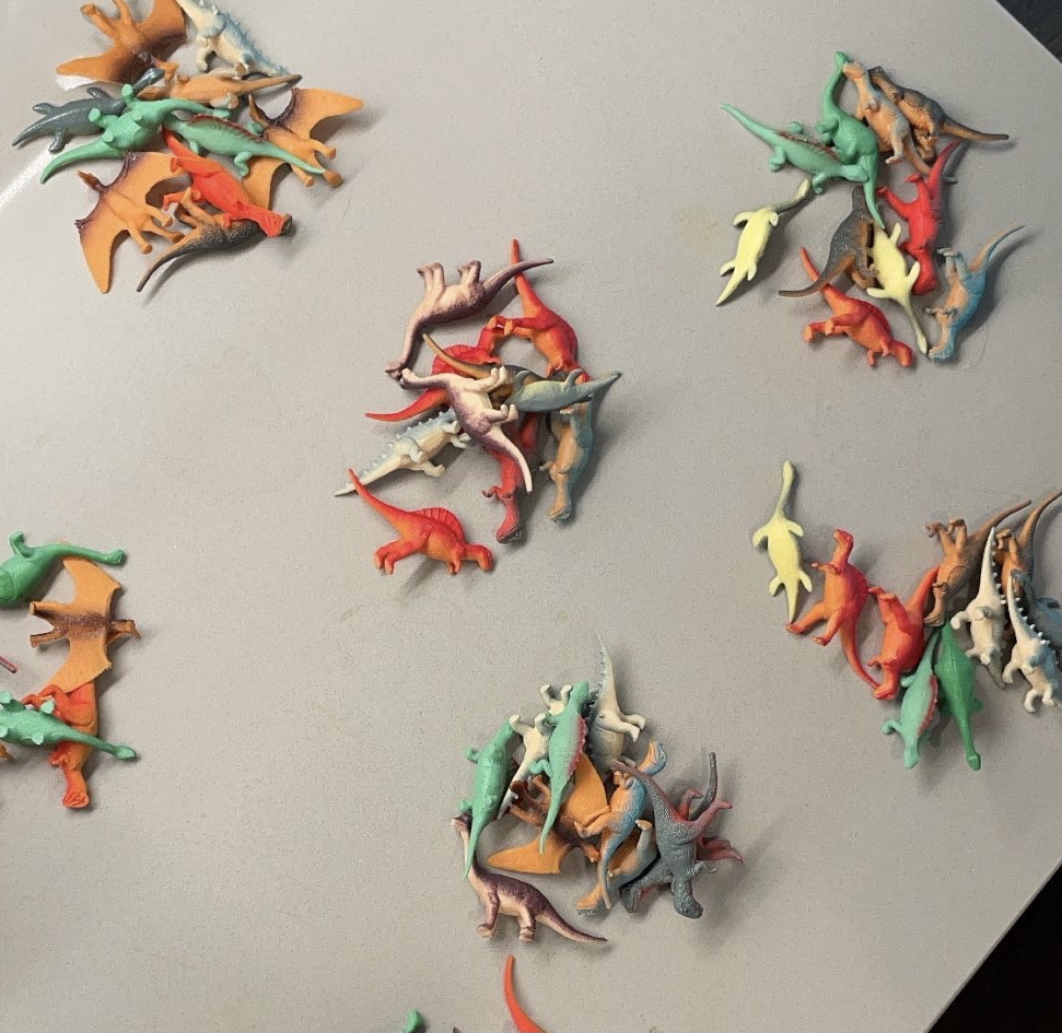 collections of small dinosaur plastic toys