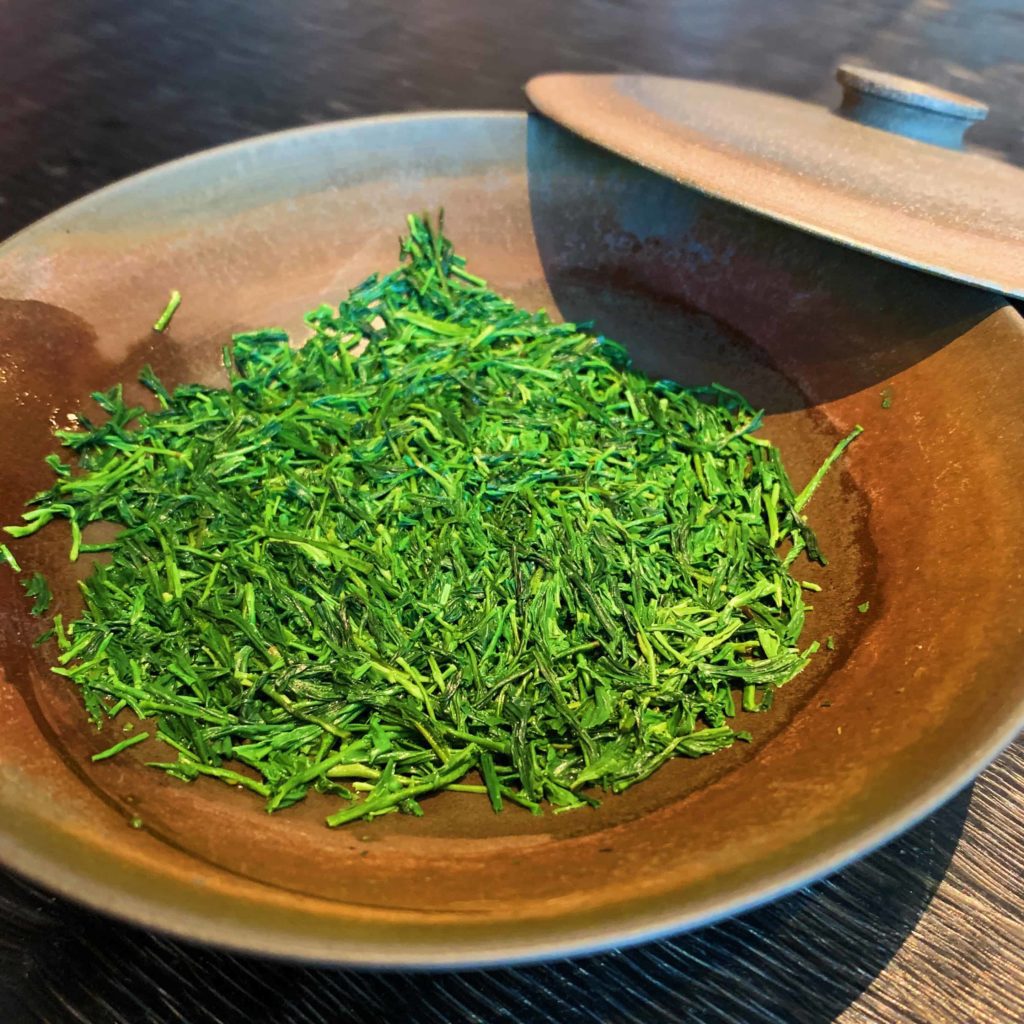 Bowl with rich green colors of tea leaves, Japanese gyokuro