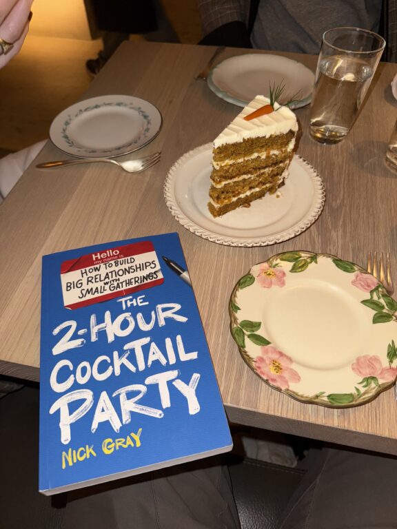 Carrot cake and book on a table