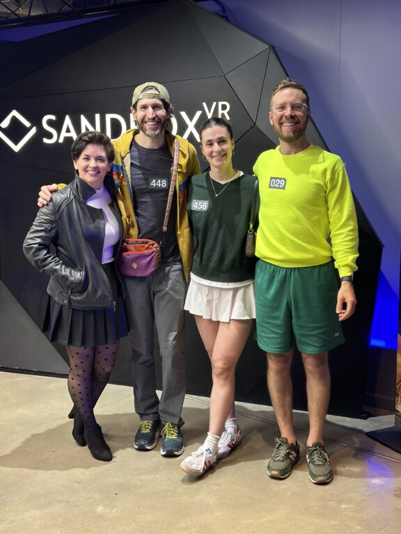 Two men and 2 women smiling