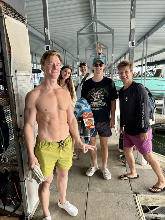 Group of people with muscular man