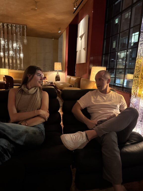 Two people sitting and talking