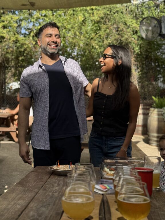 Couple smiling infront of table
