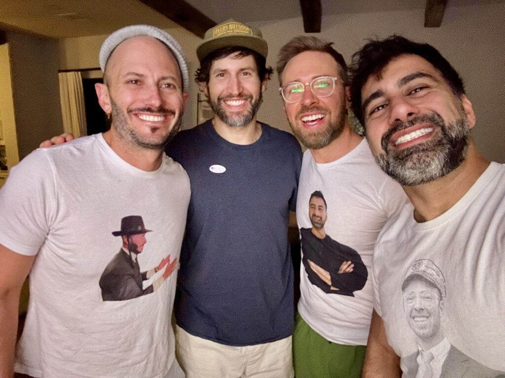 4 men smiling