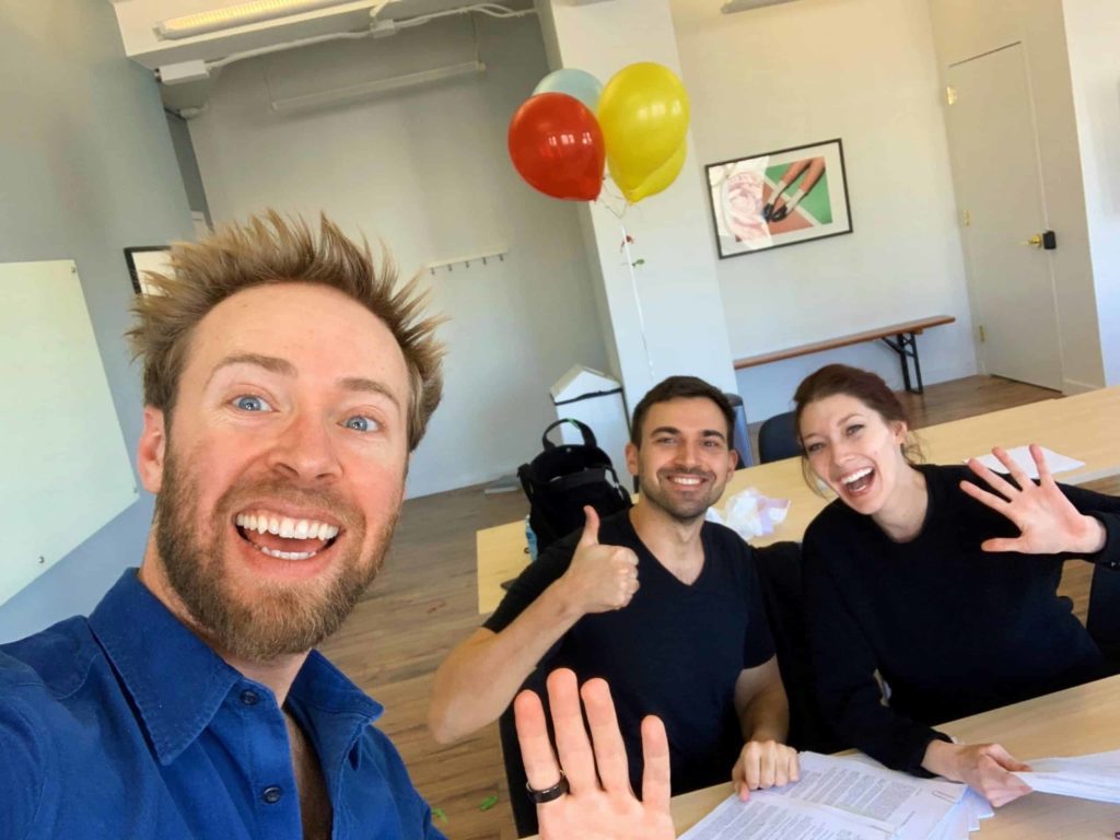 Selfie of three people in a Breather office space