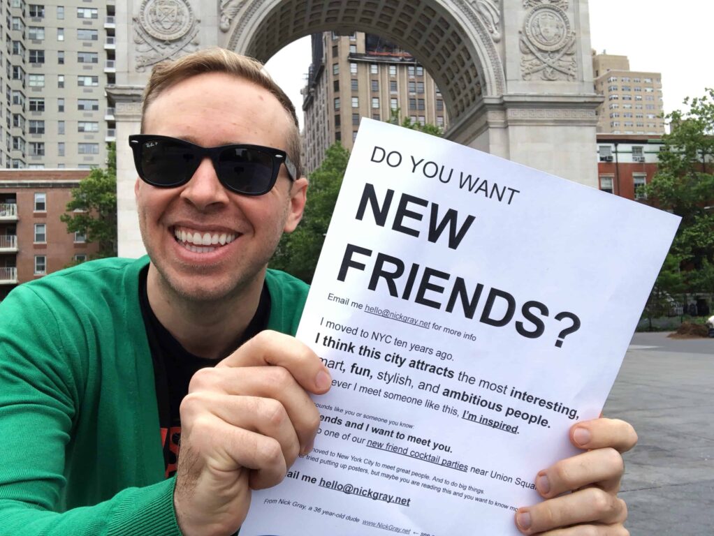 Me in Washington Square Park showing the poster that would be printed, laminated, and shared across NYC.