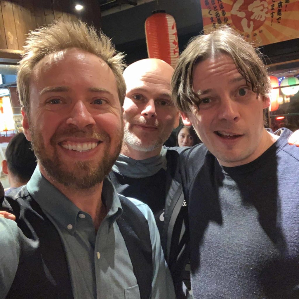 Three men, selfie in Toyo