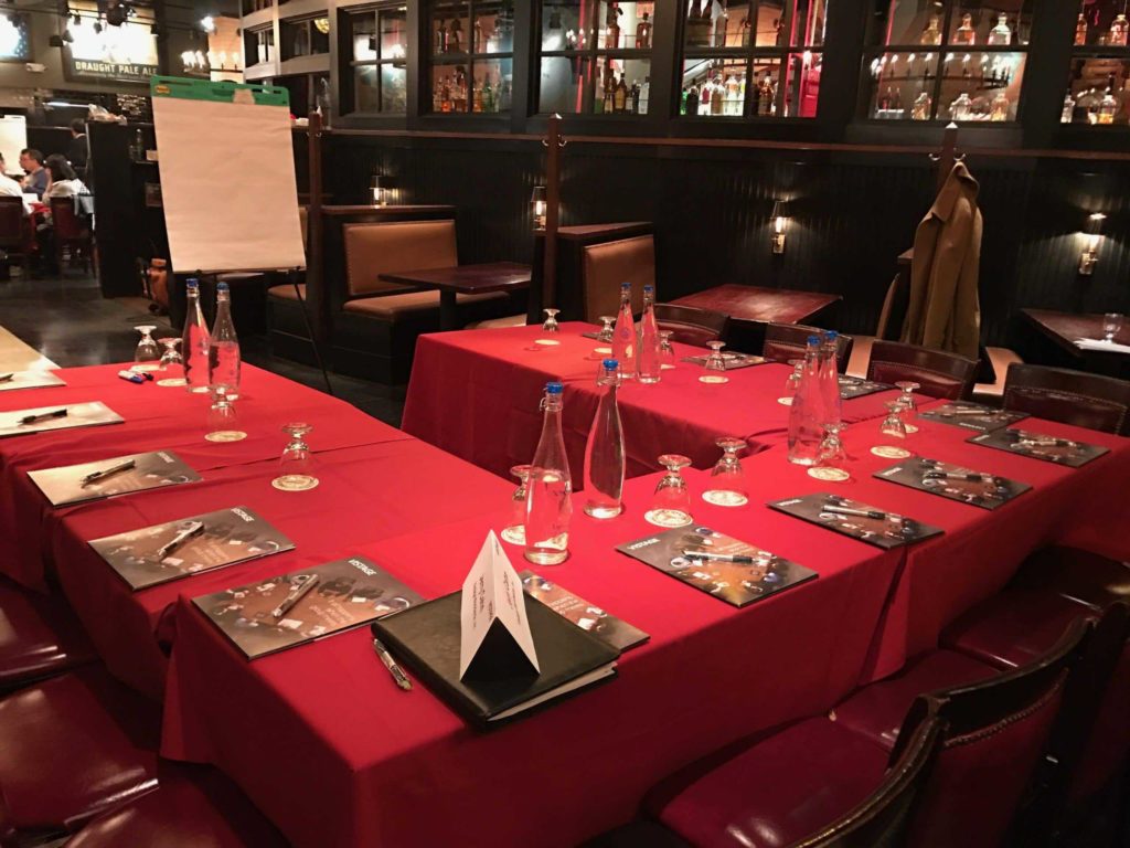 Red tablecloth over tables in the basement of a restaurant