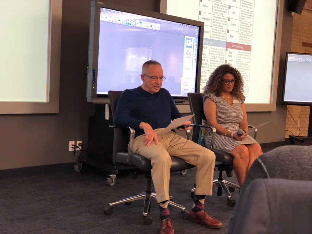 Two people in an office presentation as part of the Strategic Coach 10X workshop class
