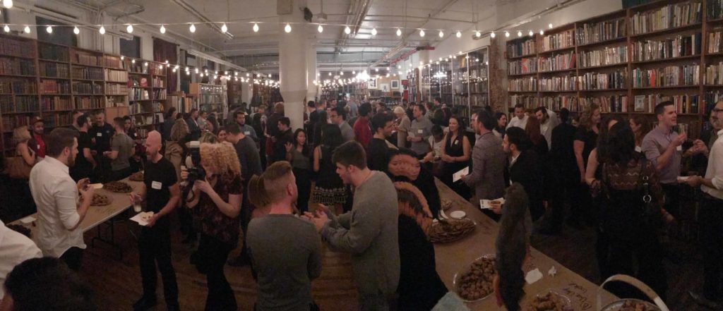 Large loft-style room with at least 150 people