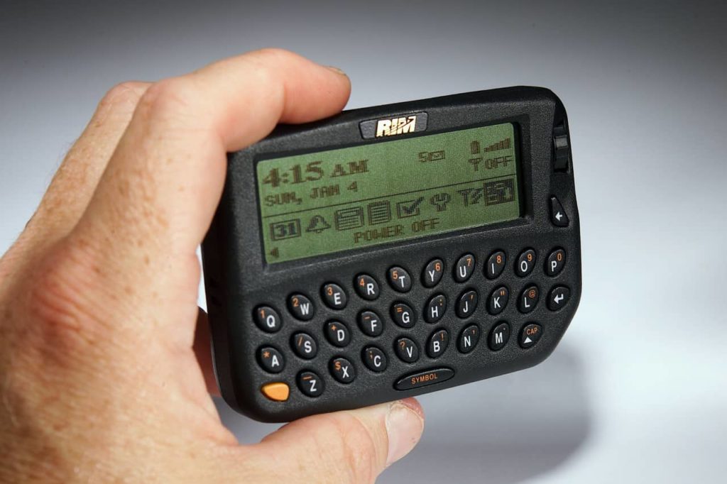 Hand holding a BlackBerry 850