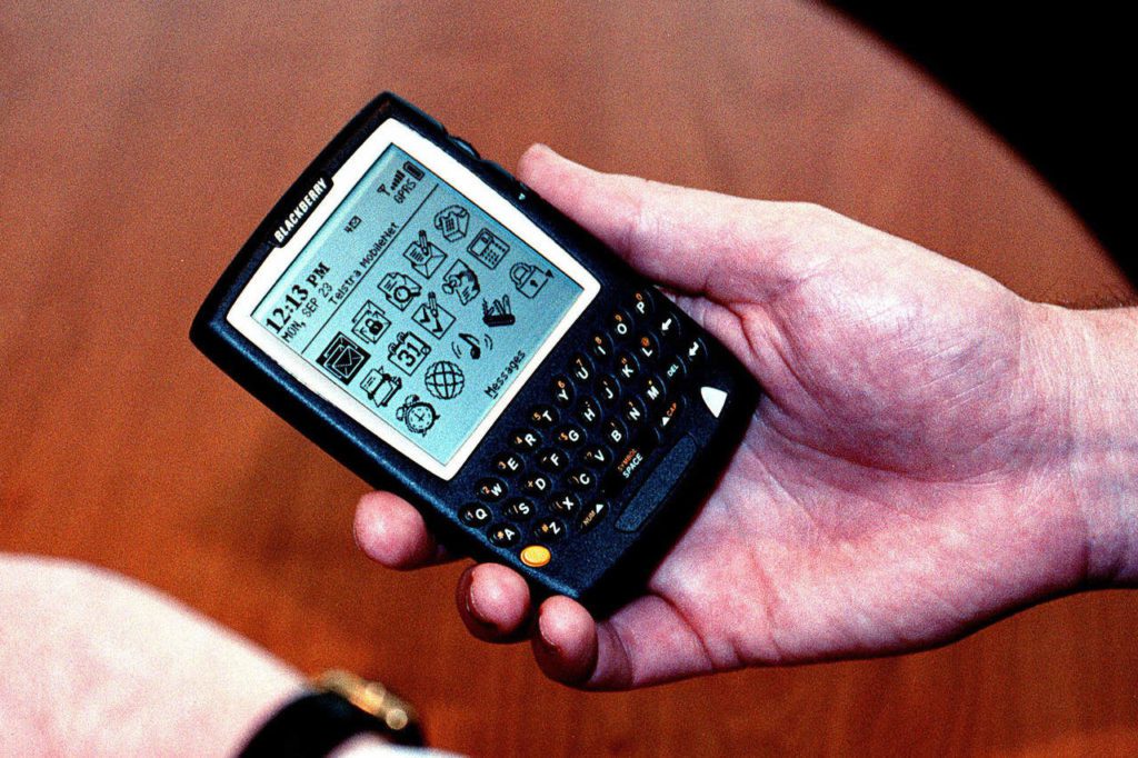 Hand holding a BlackBerry 957