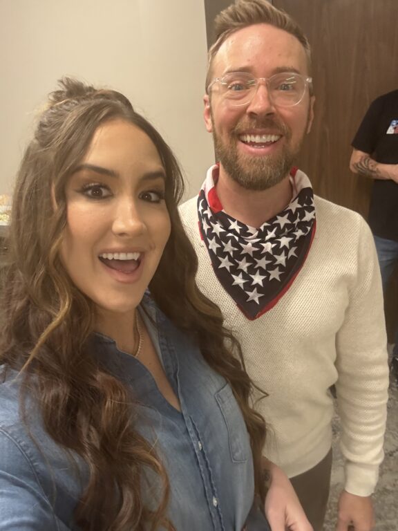 woman and a man wearing a bandana smiling