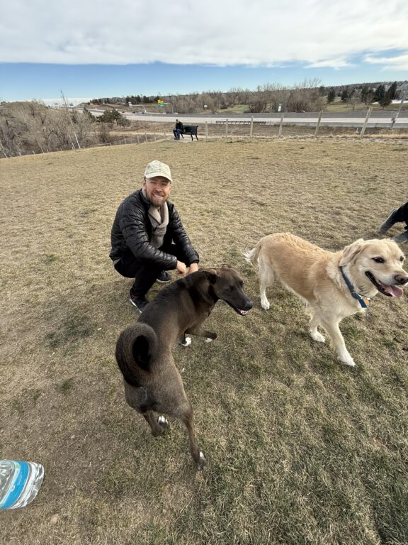 man and two dogs