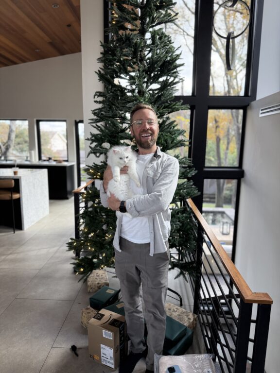 man holding a cat