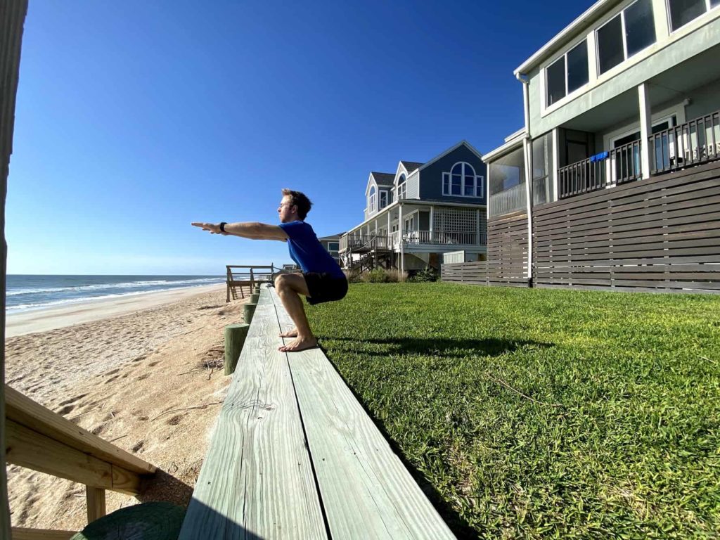 Man outside, squatting