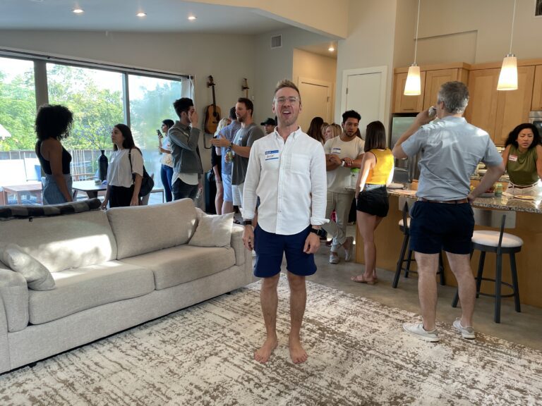 Nick standing in the middle of the party