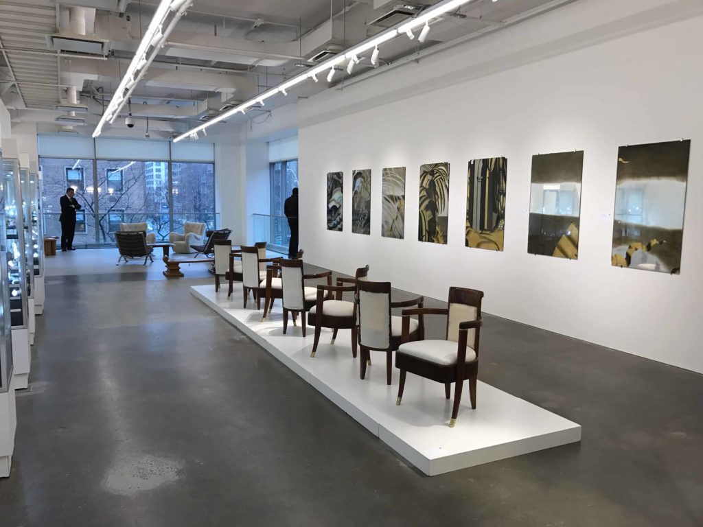 Panels lined up along the wall with chairs from Normandie also for auction