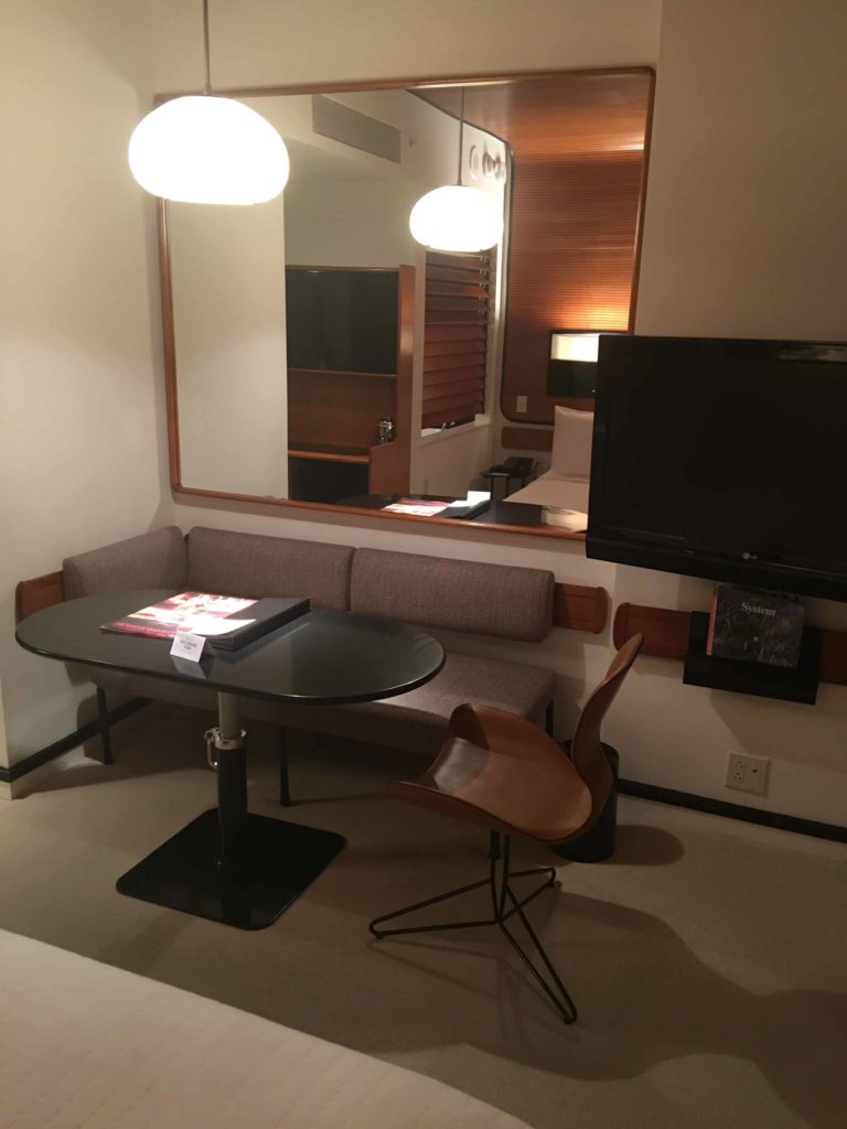 Desk and work area, immediately at the foot of the bed.
