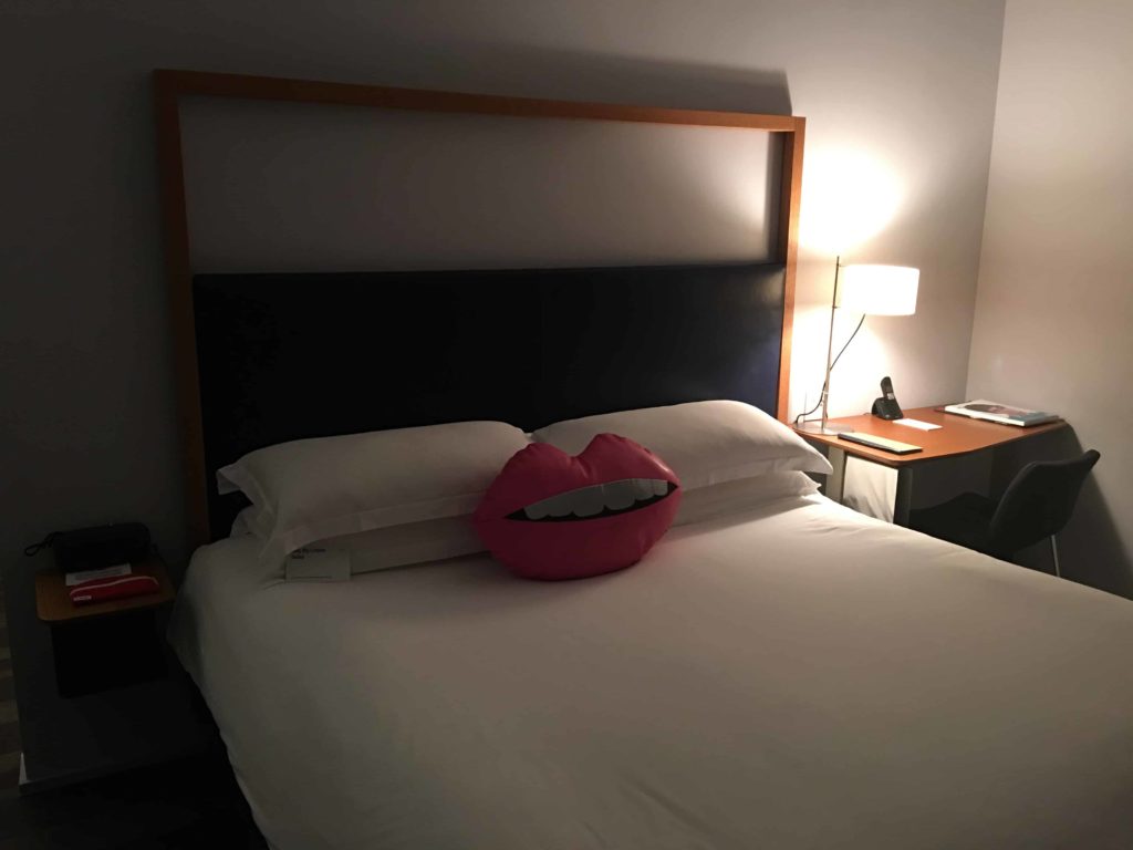 Bed, with a cutesy lips pillow which strangely annoyed me.