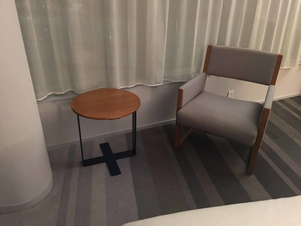 Little desk and chair next to bed. These were nice.