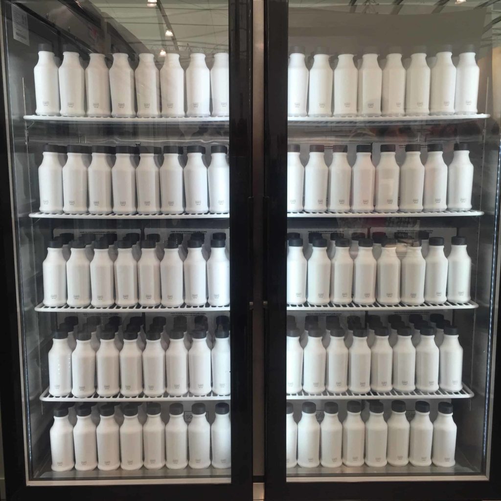 Many bottles of Soylent in the industrial refrigerators. Photo by Sam Shankman