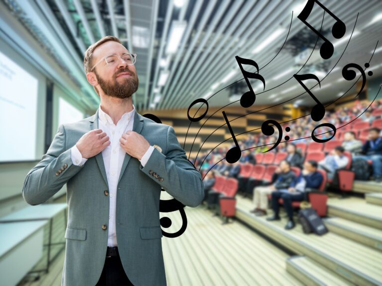 Man standing infront of crowd with music
