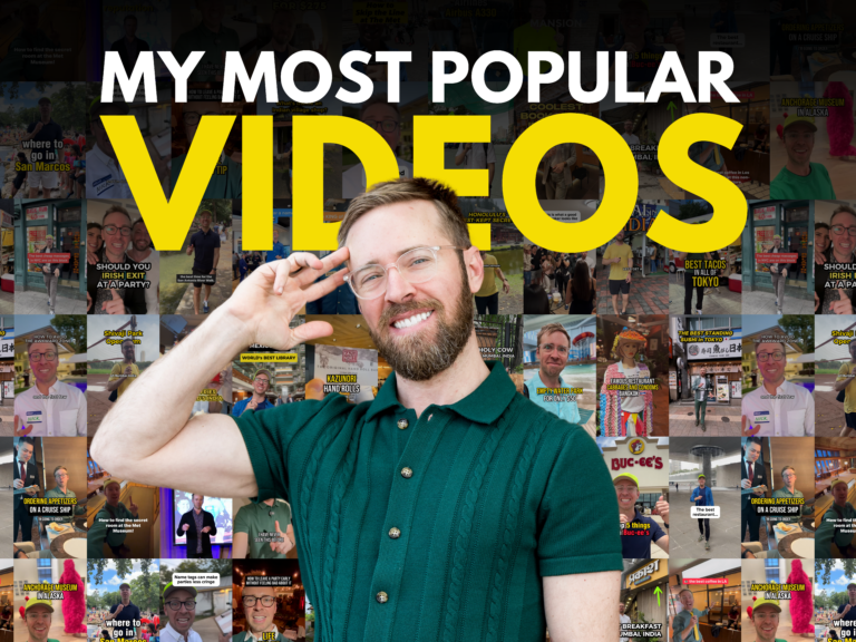 Nick standing at the middle with collage of video covers at the background