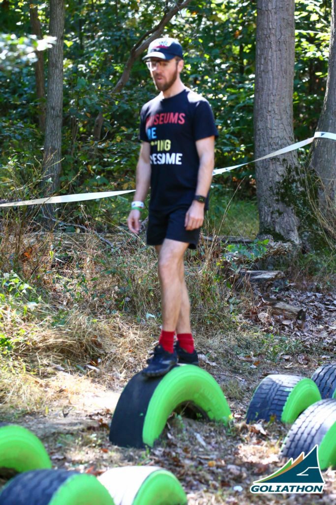 Man wearing a shirt that says MUSUEMS ARE F***ING AWESOME