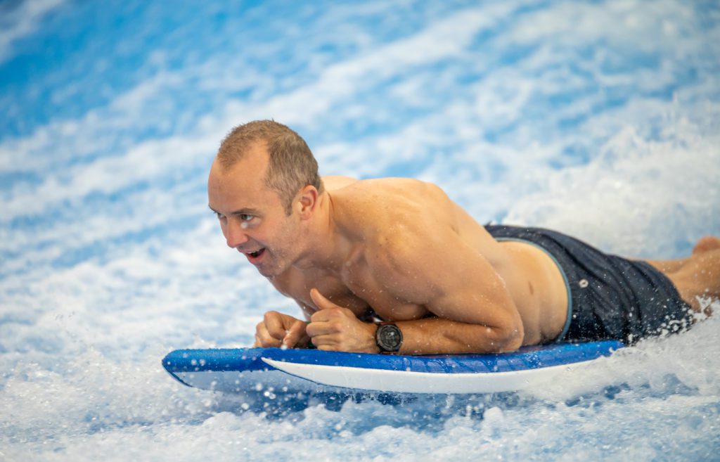 Zach Ware on the Flowrider surf machine in Round Rock, Texas