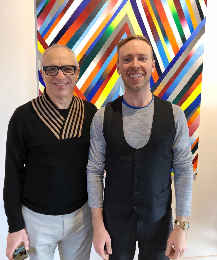 Two men standing next to each other