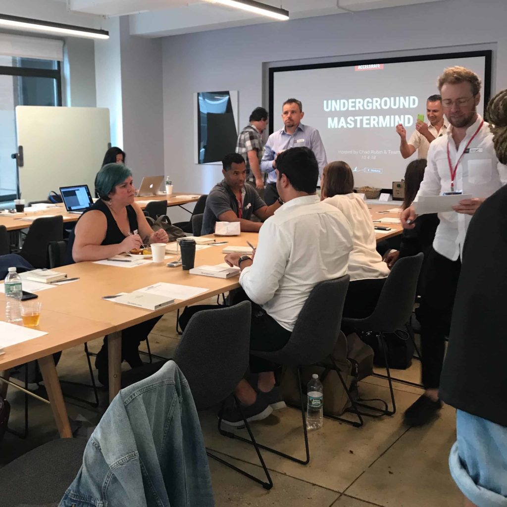 People in a conference room st Skubana Accelerate for Amazon Sellers