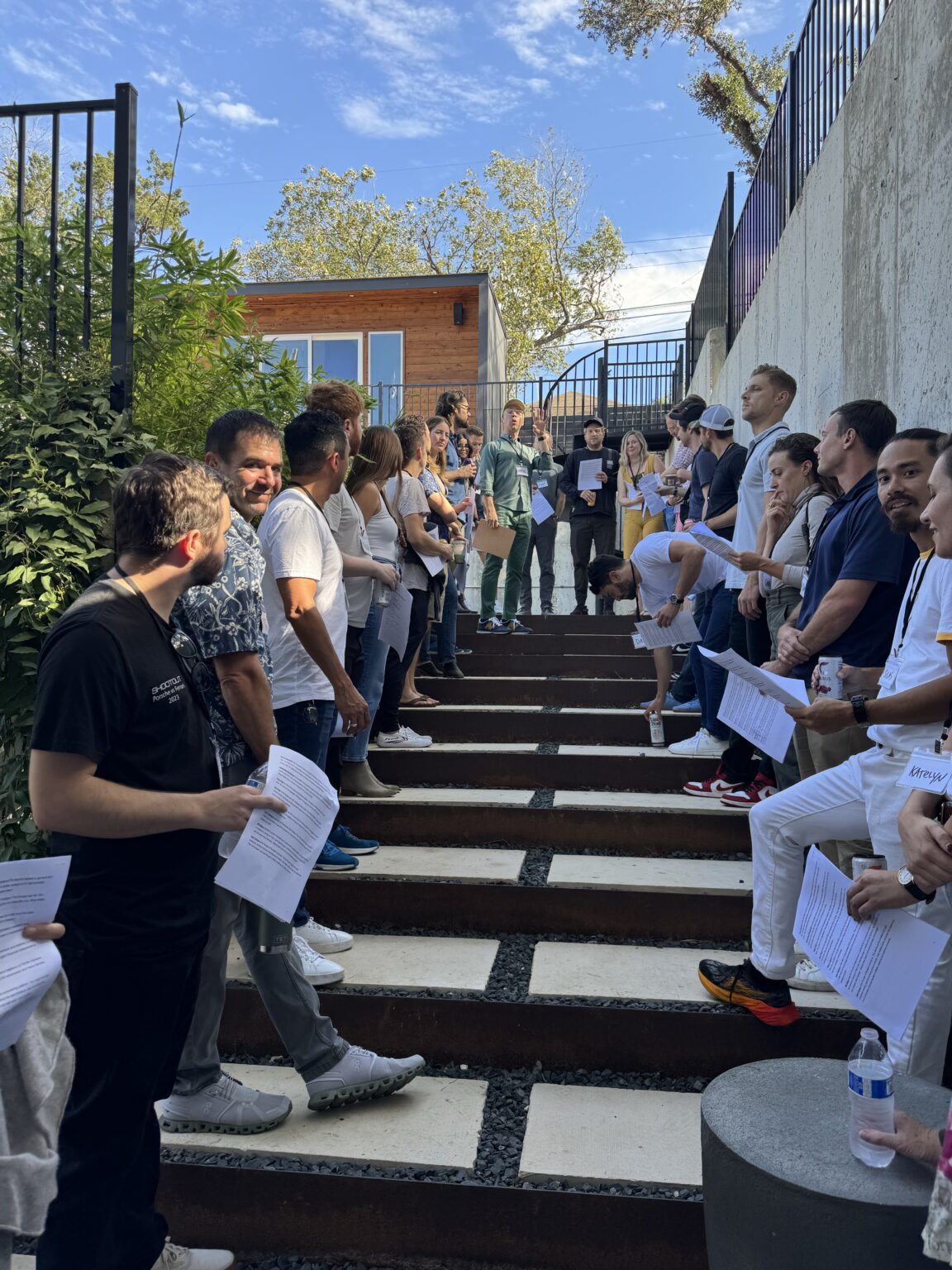 group of people standing outside on stairs