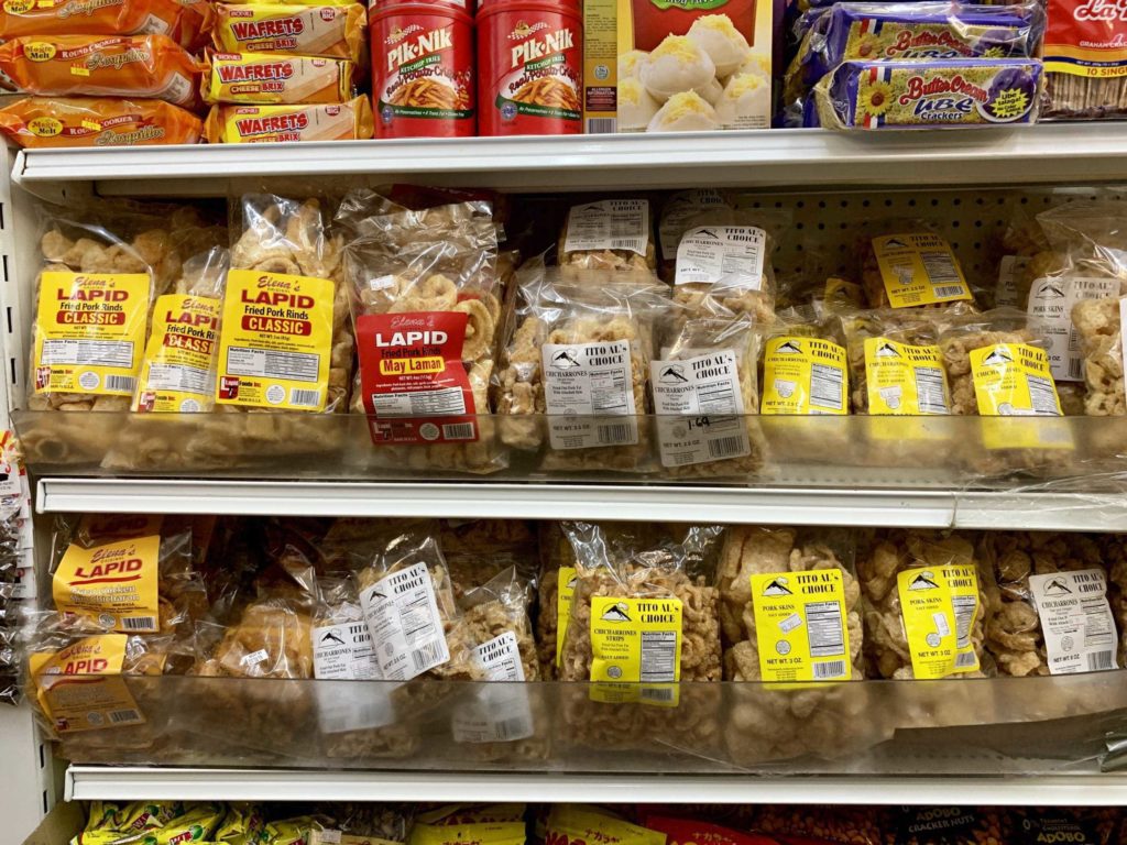 Three rows of different bags inside a shop