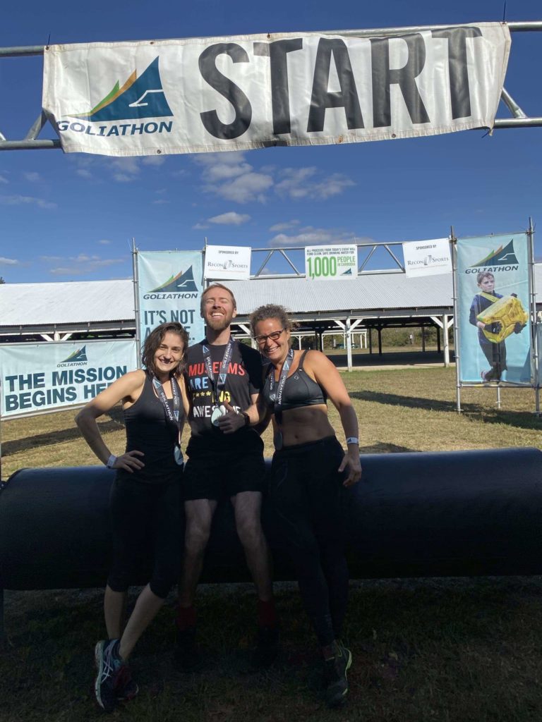 Three people at the start line of Goliathon