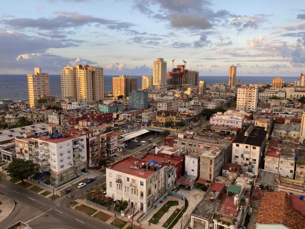 City view from 16th floor looking out at sunset, lots of old buildings