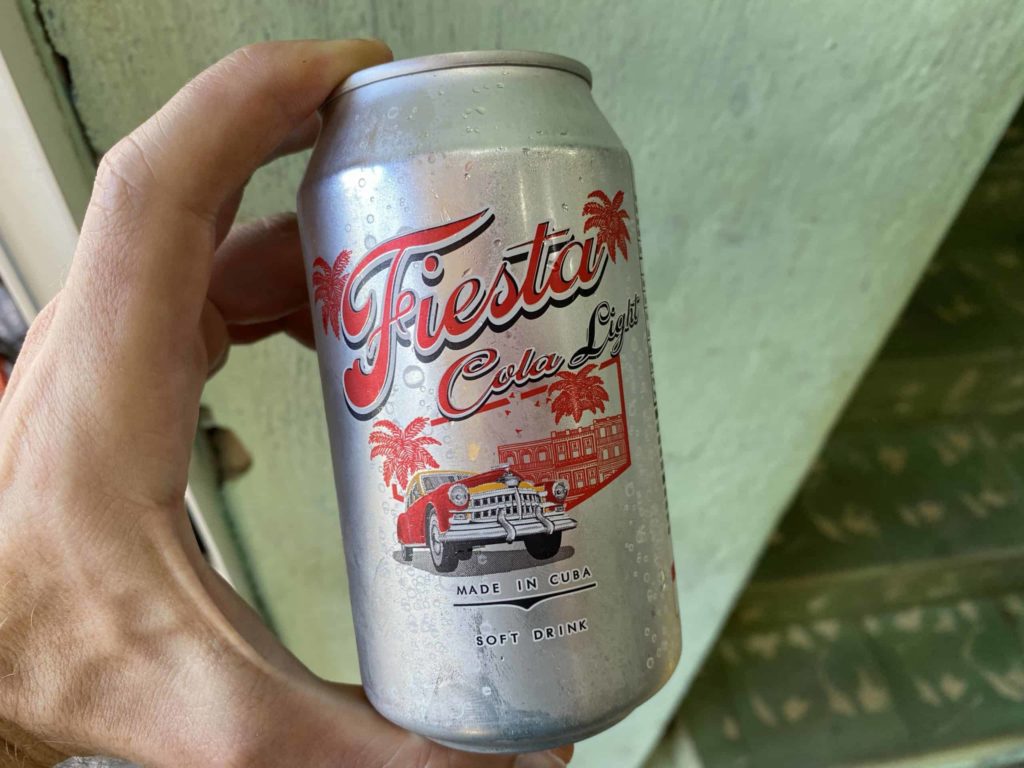 Silver can of soda with old American car on the front q