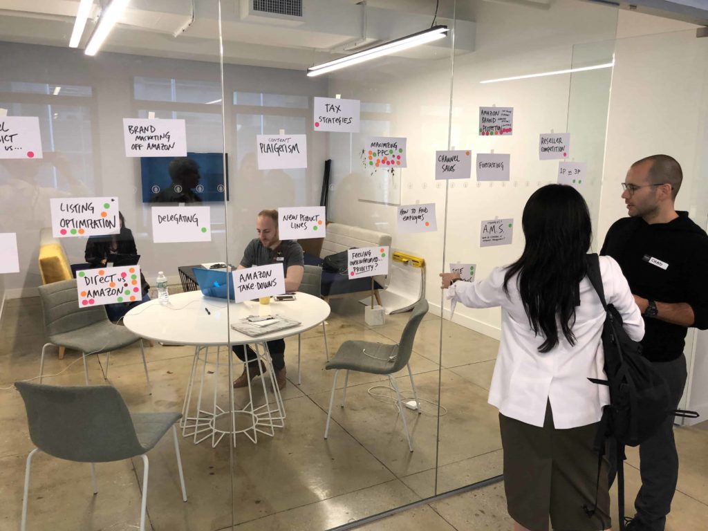 Conference room with white notecards that have a variety of topics written on them