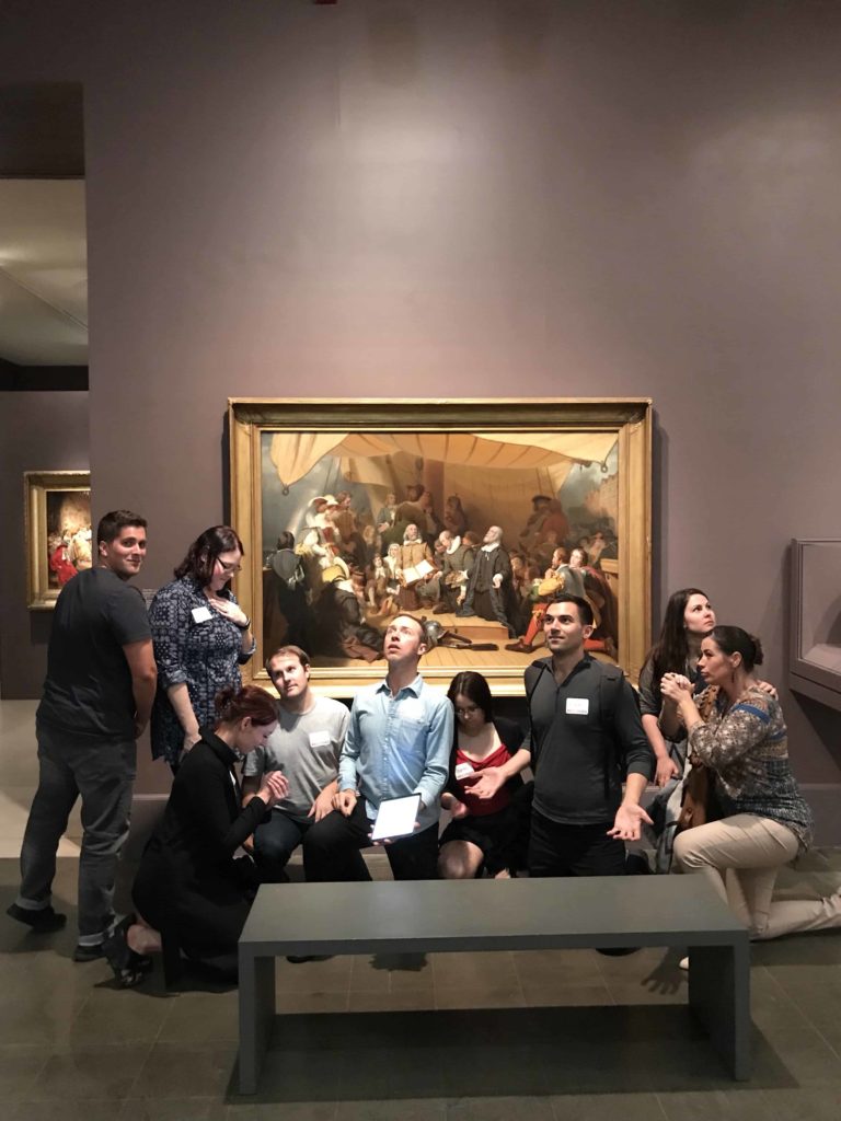 Group of people in front of painting doing Tableau vivant