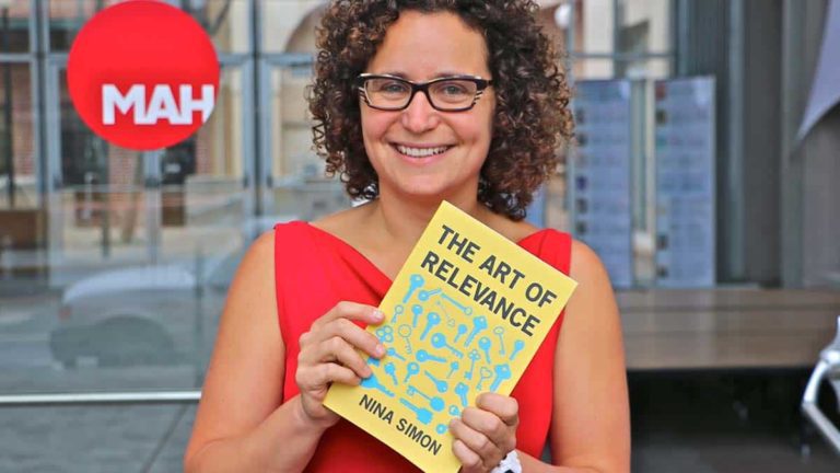 Nina Simon holding her book The Art Of Relevance