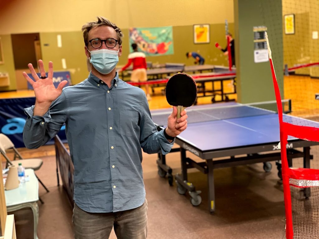 man standing inside the Dallas Table Tennis Club in Carrollton, Texas