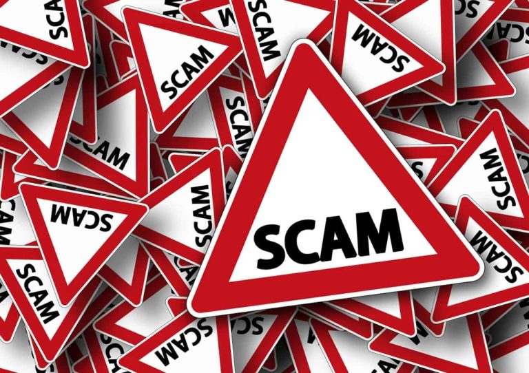road sign with a writing SCAM