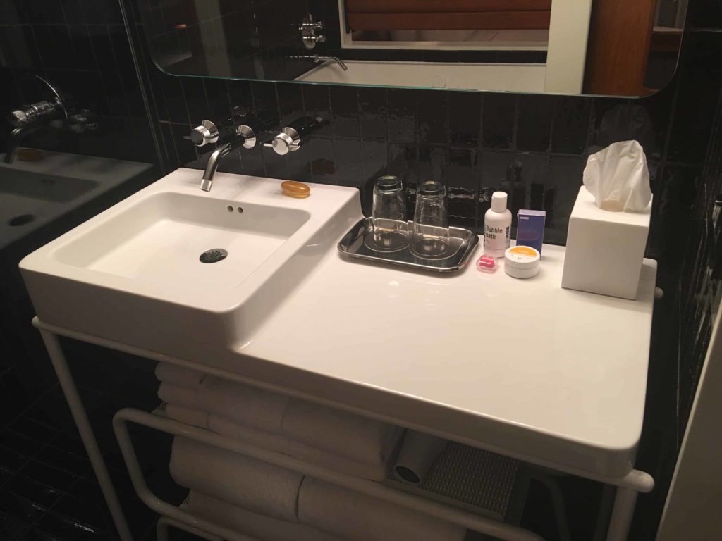 Bathroom sink. Typically I don't like the minimal "towels underneath the sink" setup, but it doesn't bother me as much at The Standard.