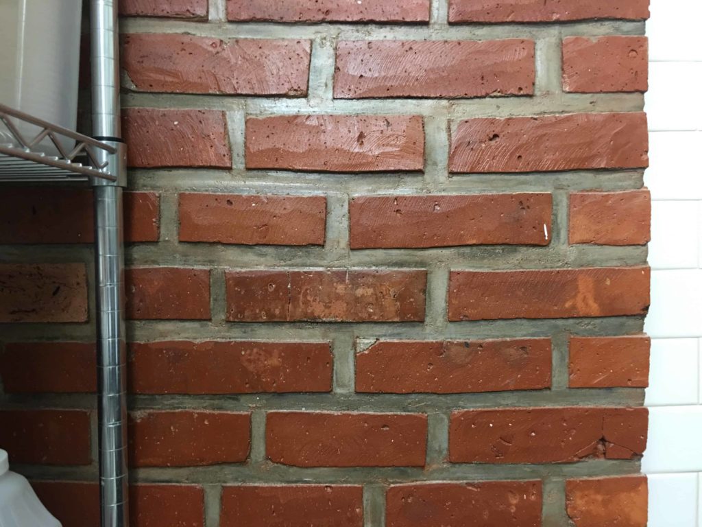 Brick wall with heavy mortar joints, as seen in the mixing room.