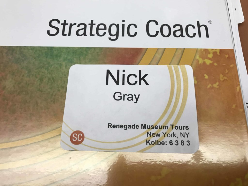 My name tag and a Strategic Coach folder