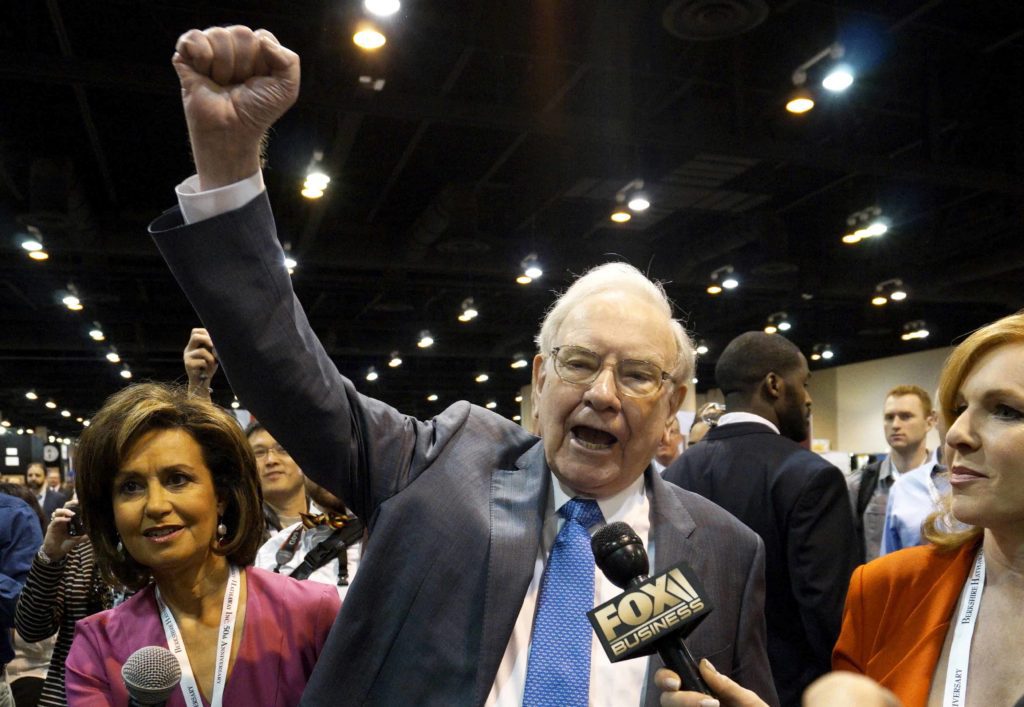 Berkshire Hathaway CEO Warren Buffett yells "Go big red!"