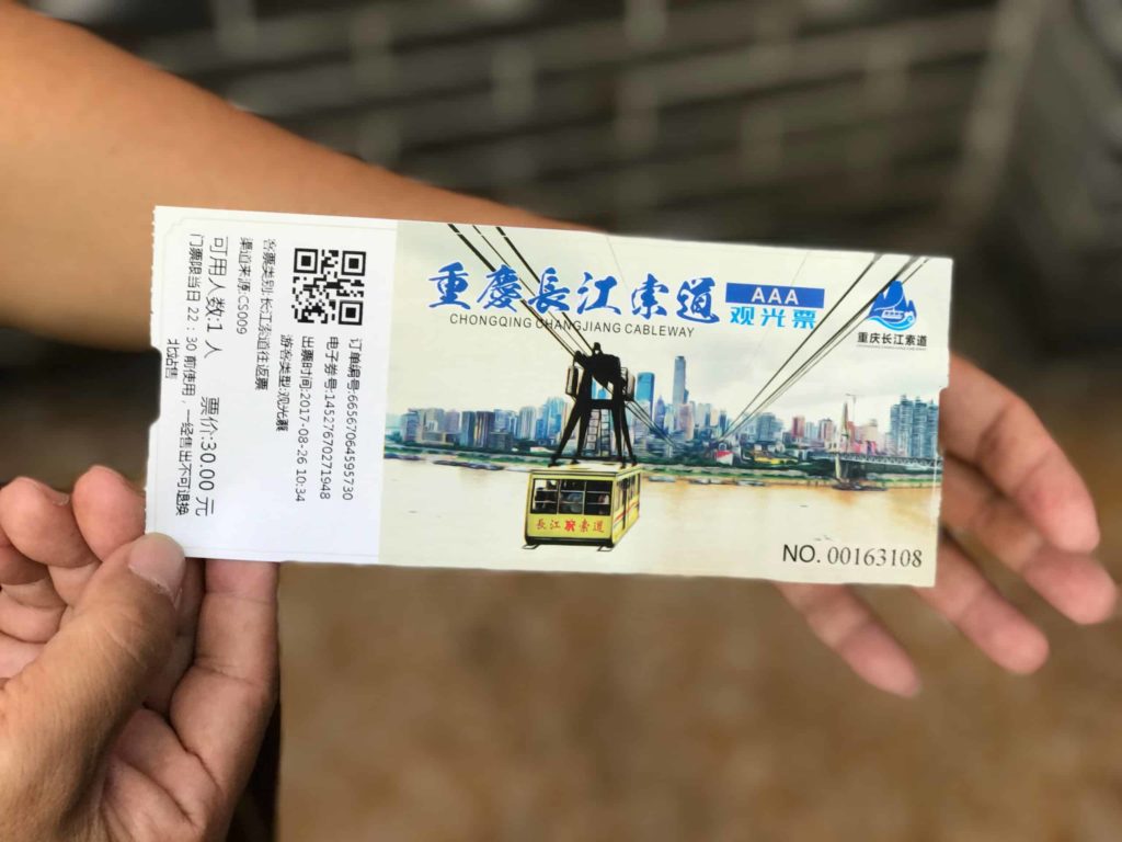 holding a ticket to the Chongqing cable car